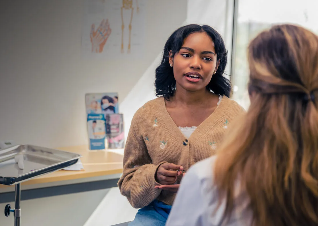 A doctor consults with a patient.