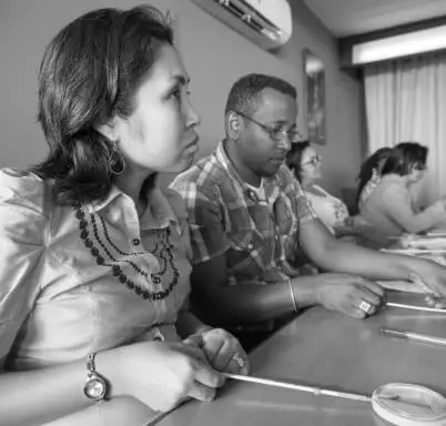 A group of people sitting at tables.