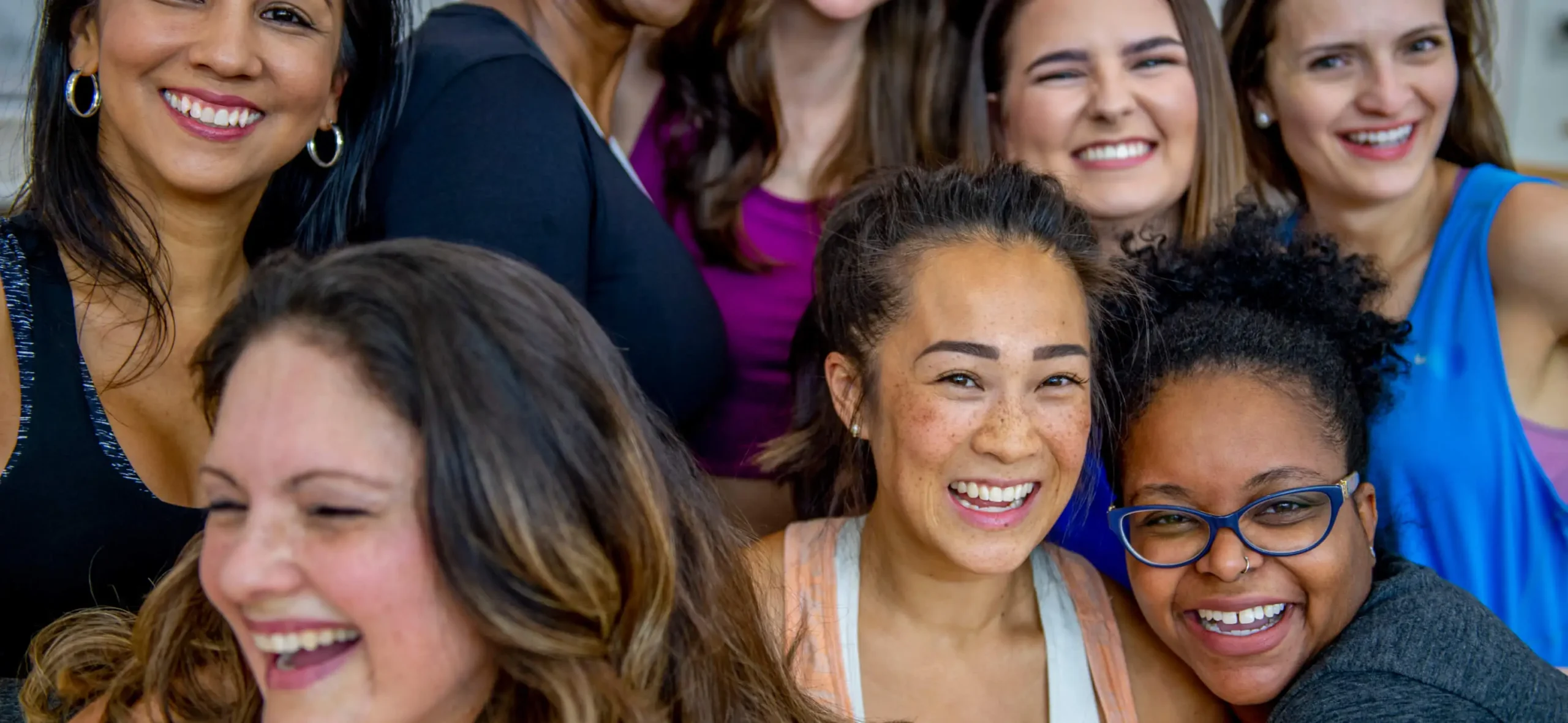 A group of women smiling.